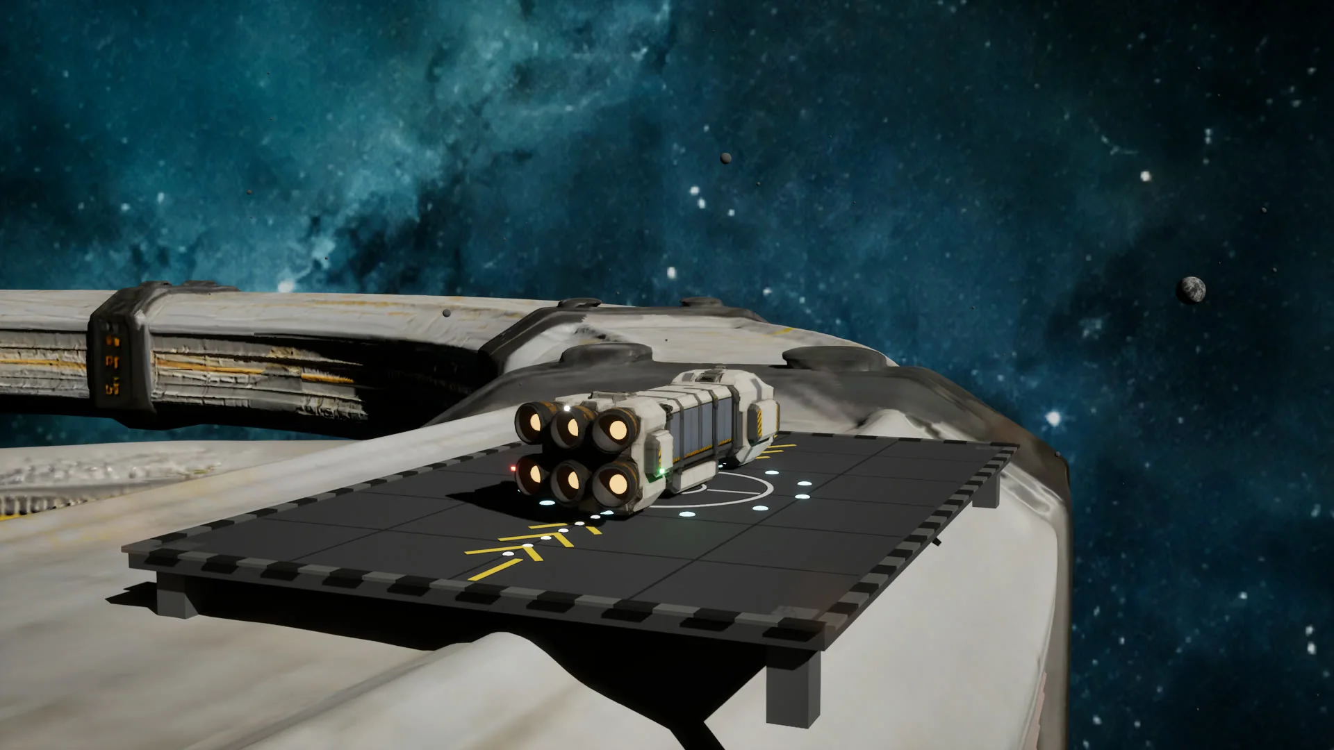 A ship resting on a station landing pad under work lighting.